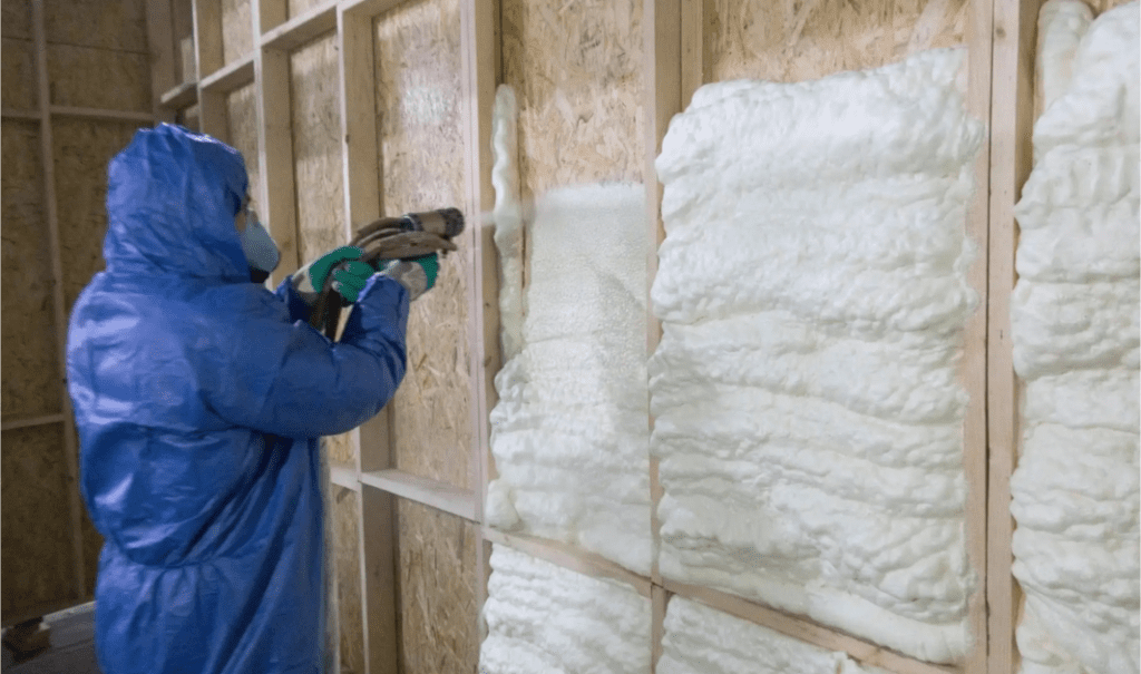 Spray form being installed in walls by CT Insulation Services expert