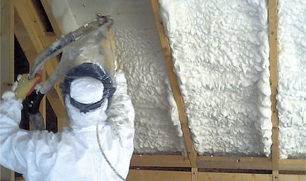 Spray form being installed in ceiling panels by CT Insulation Services expert