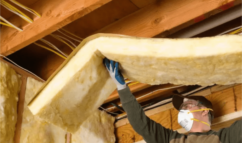 Soundproof insulation being installed by CT Insulation Services expert